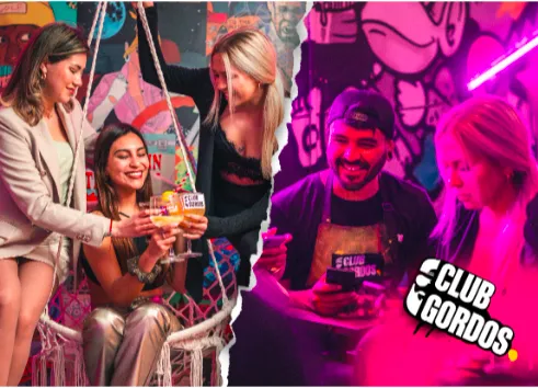 Fotografía de personas disfrutando en el interior de Club Gordos que deja ver que en su interior hay grafitis y variedad de luces.